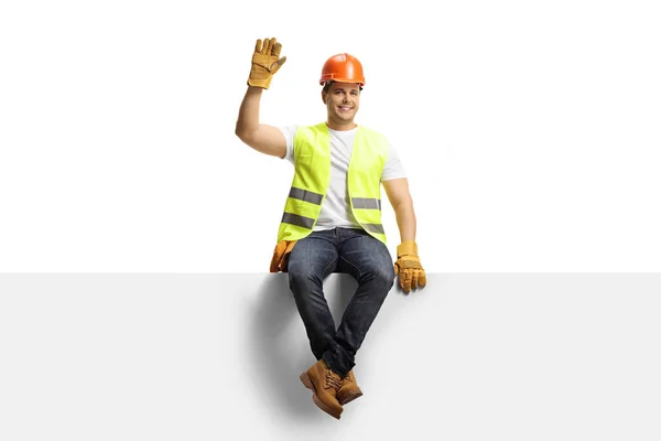 Construction Worker Helmet Sitting Blank Panel Waving Camera Isolated White — Stock Photo, Image