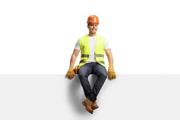 Trabajador Construcción Con Casco Sentado Panel Blanco Aislado Sobre Fondo —  Fotos de Stock