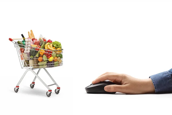 Männliche Hand Mit Einer Computermaus Und Einem Einkaufswagen Mit Lebensmitteln — Stockfoto