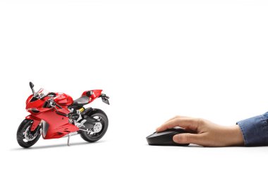 Male hand clicking on a computer mouse and a red racing motorbike isolated on white background clipart