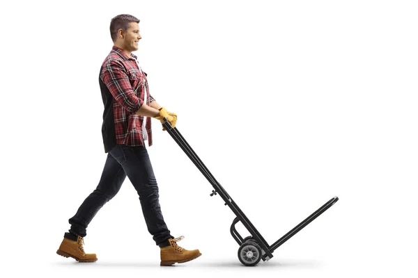 Full Length Profile Shot Man Pushing Empty Hand Truck Isolated — Zdjęcie stockowe