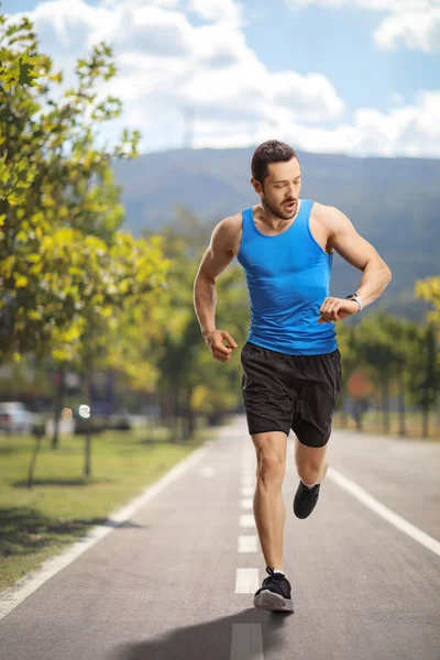 Full Length Portrait Male Runner Checking Time Running Path — Stock Photo, Image