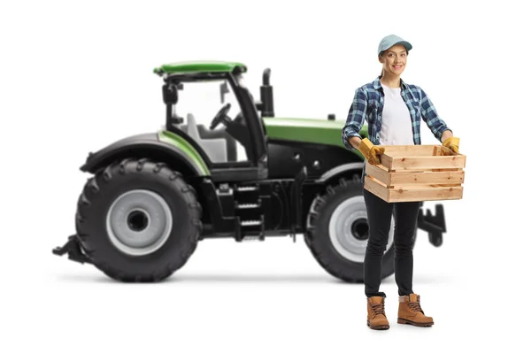 Full Length Portrait Female Farmer Holding Crate Front Tractor Isolated — Stock Photo, Image