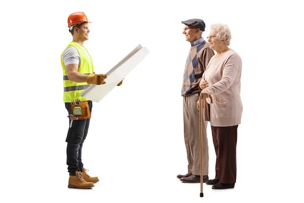 Full Length Profile Shot Construction Worker Holding Blueprint Talking Elderly — Stock Photo, Image