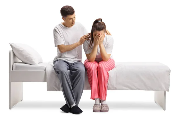 Young Female Pajamas Sitting Bed Crying Guy Comforting Her Isolated — Stock Photo, Image