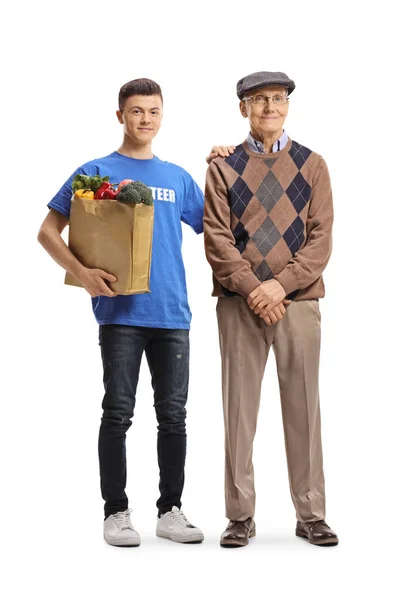 Young Male Volunteer Helping Elderly Man Grocery Shopping Isolated White — Stock Photo, Image