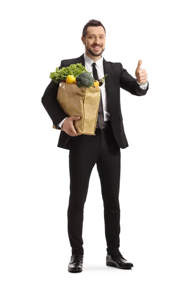 Full Length Portrait Businessman Carrying Grocery Bag Showing Thumbs Isolated — Stock Photo, Image