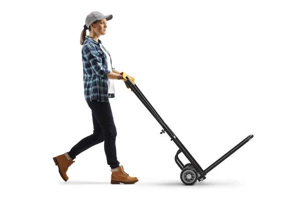 Full Length Profile Shot Female Worker Pushing Empty Hand Truck — Zdjęcie stockowe