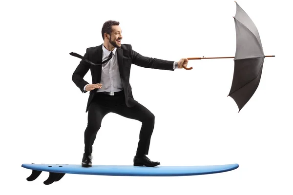 Businessman Riding Surfboard Holding Umbrella Isolated White Background — Stock Photo, Image