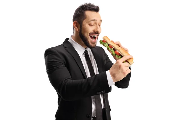 직업적 남자가 배경에 떨어져 바게트를 샌드위치를 — 스톡 사진