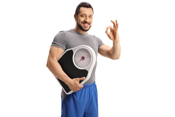 Smiling Young Man Holding Weight Scale Gesturing Sign Isolated White — Stock Photo, Image