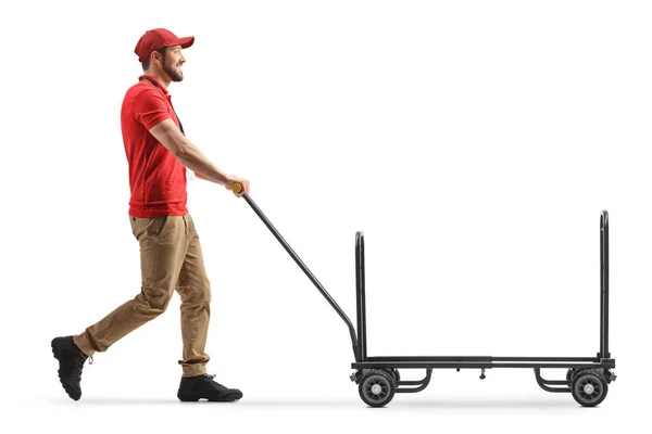 Bezorger Duwen Van Een Lege Handtruck Geïsoleerd Witte Achtergrond — Stockfoto