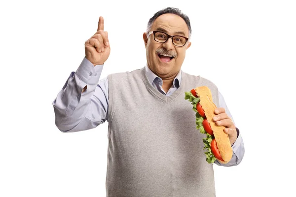 Smiling Mature Man Eating Sandwich Salad Pointing Isolated White Background — Stock Photo, Image