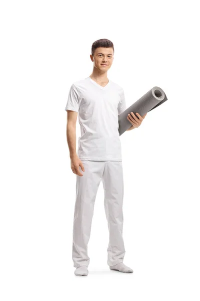 Full Length Portrait Guy White Clothes Holding Exercise Mat Isolated — Stock Photo, Image