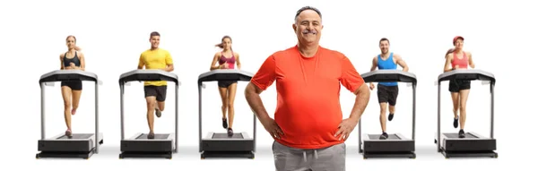 Corpulent Mature Man Sportswear Standing Front People Running Treadmills Isolated — Stock Photo, Image