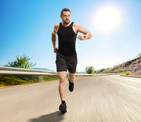 Full Length Portrait Young Man Smartwatch Running Open Road — Stock Photo, Image