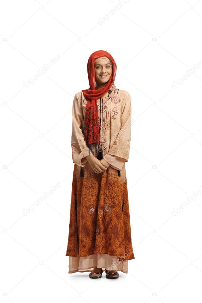Full length portrait of a young muslim woman in traditional clothes isolated on white background
