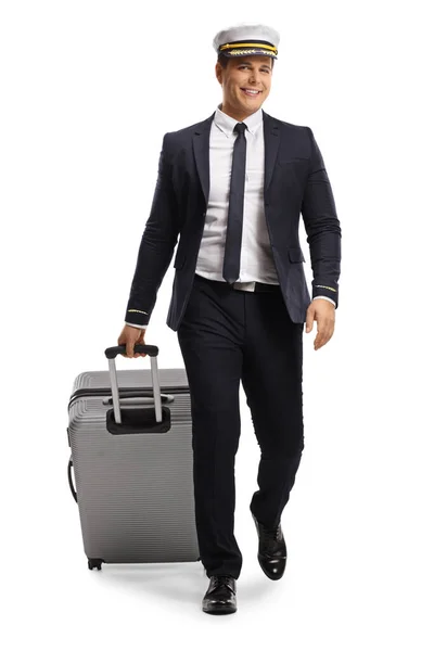 Full Length Portrait Young Pilot Walking Camera Pulling Suitcase Isolated — Stock Photo, Image