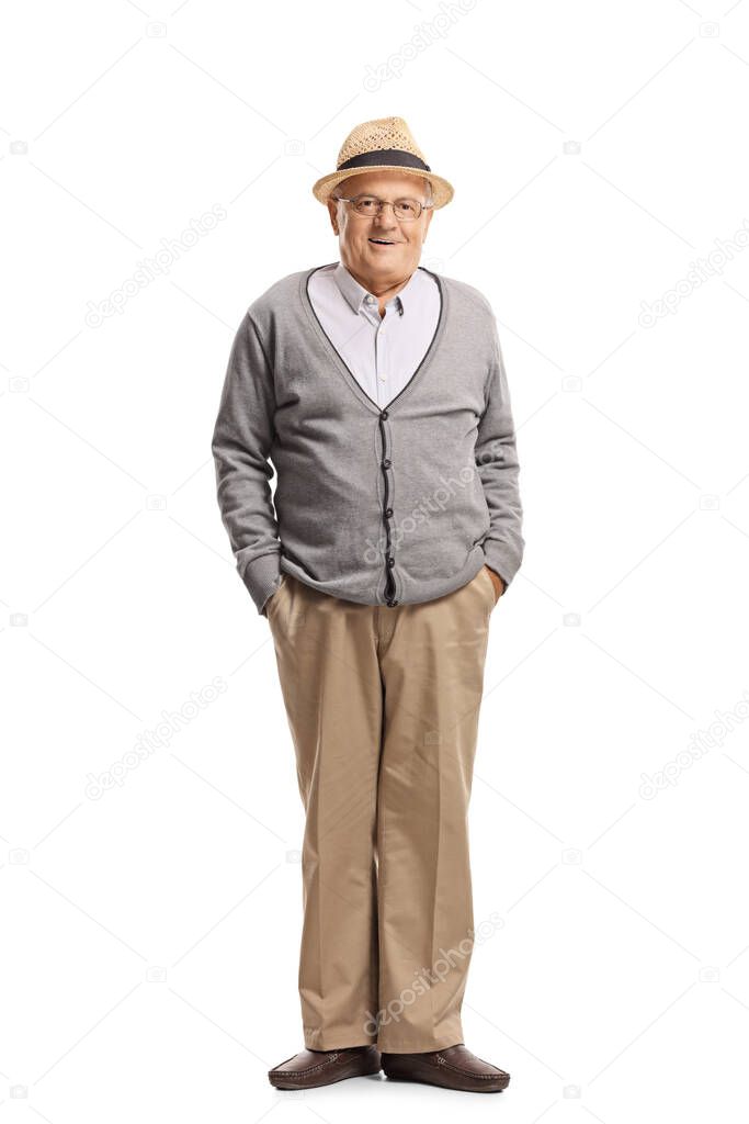 Full length portrait of a grandfather standing with hands in pockets and posing isolated on white background