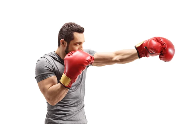 Full Length Shot Strong Young Man Punching Boxing Gloves Isolated — Zdjęcie stockowe