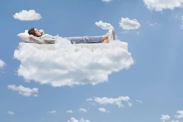 Teenage Girl Jeans Hoodie Resting Mattress Clouds Sky — Stock Photo, Image