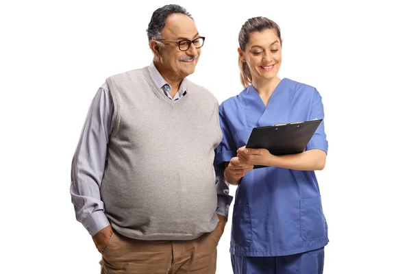 Young Female Medical Worker Showing Document Mature Man Isolated White — Stock Photo, Image