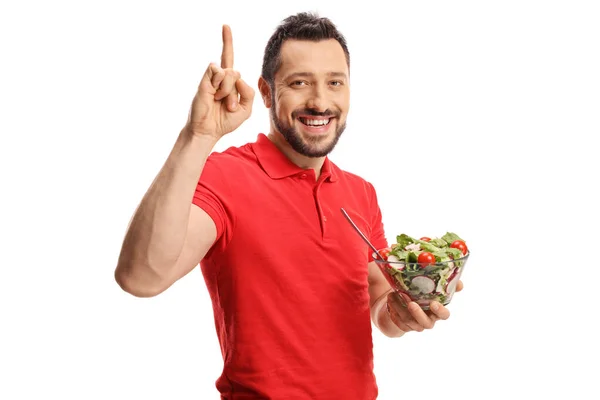 Jeune Homme Tenant Bol Salade Fraîche Pointant Vers Haut Isolé — Photo