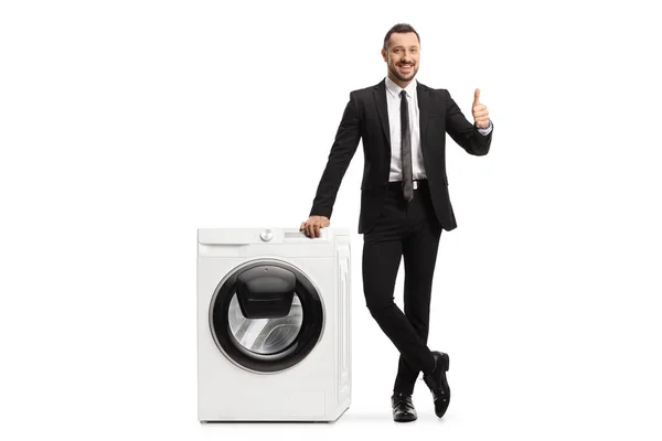 Full Length Portrait Businessman Leaning Washing Machine Showing Thumbs Isolated — Stock Photo, Image