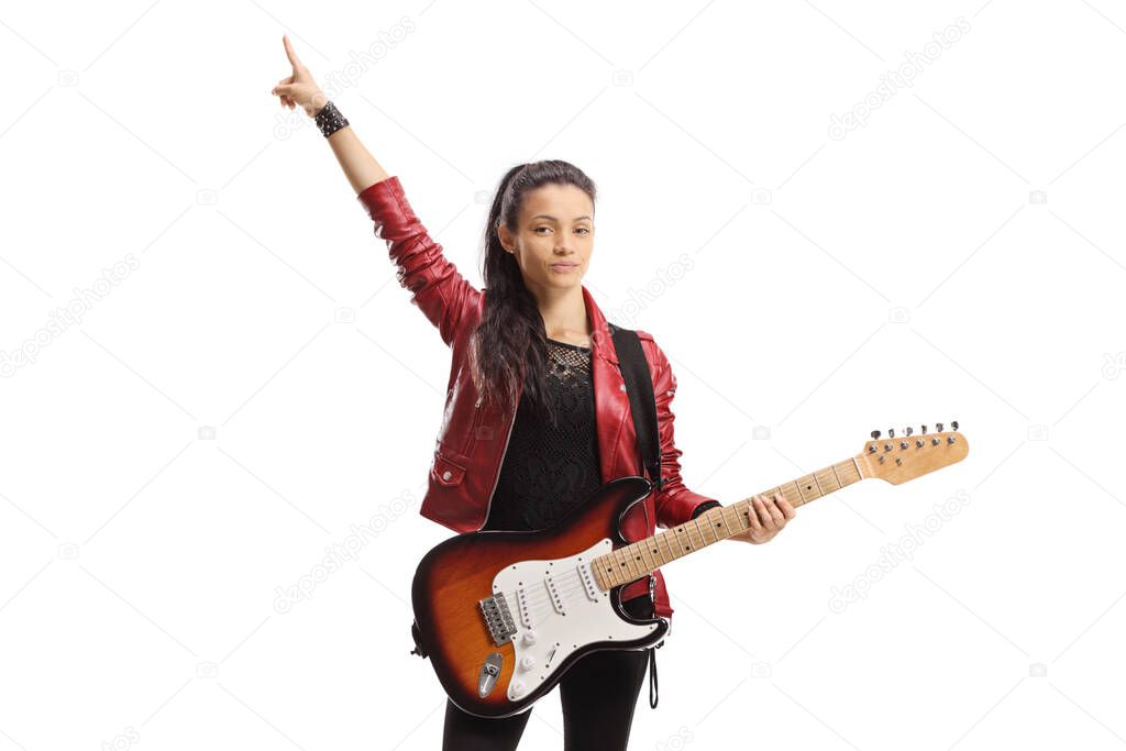 Young female with a guitar standing and pointing up isolated on white background