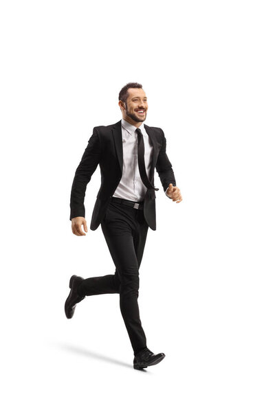Full length shot of a happy businessman running and smiling isolated on white background