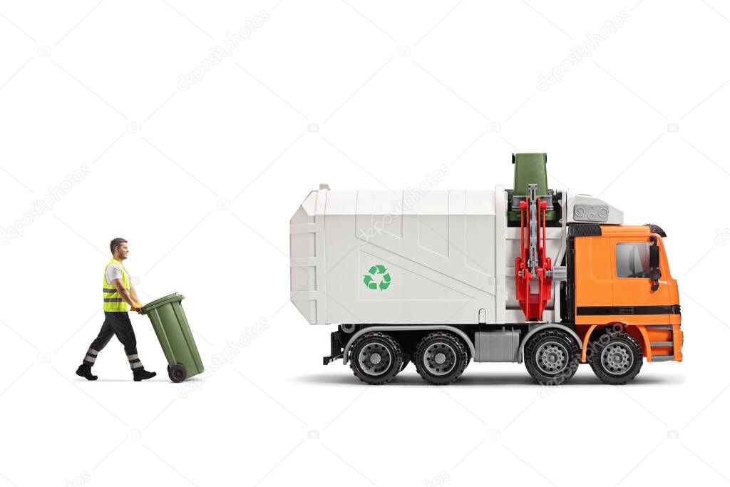 Full length profile shot of a waste collector pushing a bin towards a garbage truck isolated on white background