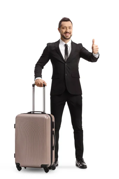 Full Length Portrait Businessman Suitcase Wheels Showing Thumbs Isolated White — Stock Photo, Image