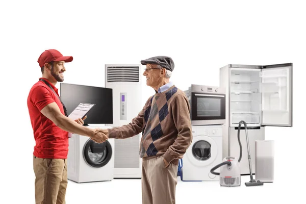 Shop Assitant Shaking Hands Elderly Man Electircal Appliances Back Isolated — Stock fotografie