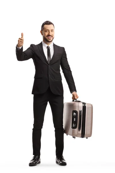 Full Length Portrait Businessman Suitcase Showing Thumbs Camera Smiling Isolated — Stockfoto