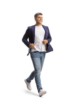 Full length shot of a man in jeans and suit running isolated on white background