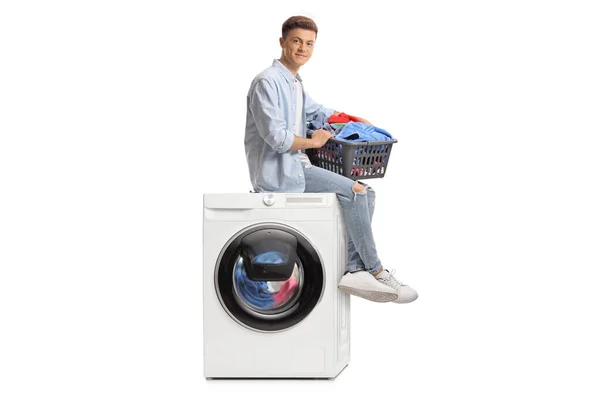 Young Guy Laundry Basket Sitting Top Washing Machine Isolated White — Stok fotoğraf