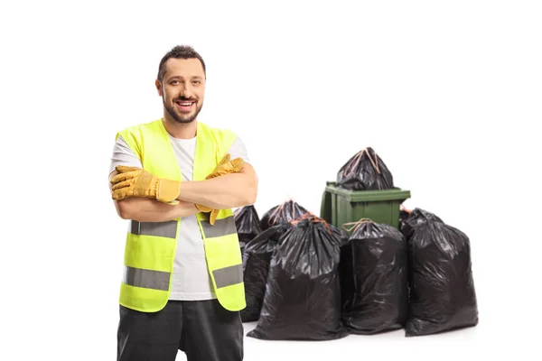 Coletor Resíduos Uniforme Luvas Posando Frente Caixote Pilha Sacos Isolados — Fotografia de Stock