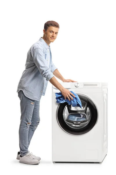 Jovem Carregando Uma Máquina Lavar Roupa Olhando Para Câmera Isolada — Fotografia de Stock