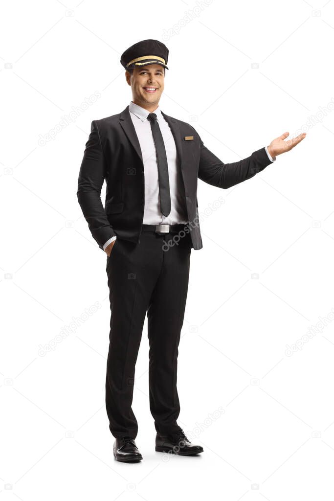 Full length portrait of a smiling chauffeur gesturing with hand isolated on white background