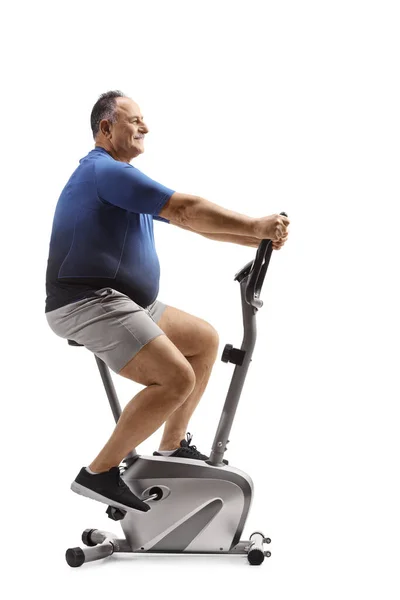 Full Length Profile Shot Corpulent Mature Man Riding Stationary Bike — Stock Photo, Image