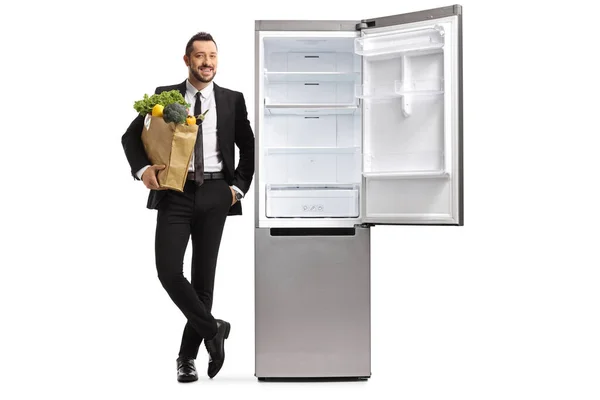 Full Length Portrait Businessman Grocery Bag Leaning Empty Open Fridge — Stock Photo, Image