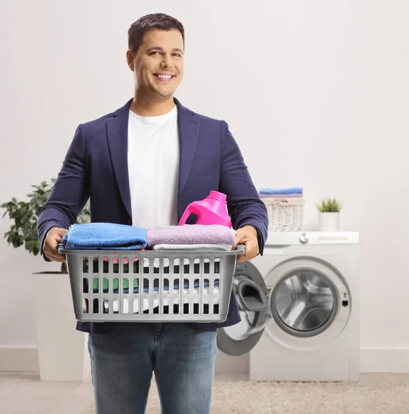 Young Man Carrying Laundry Basket Clothes Standing Bathroom — Stock Photo, Image