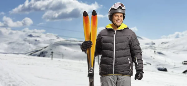 Guy Holding Pair Skis Posing Snowy Mountain Ski Resort — Stock Photo, Image