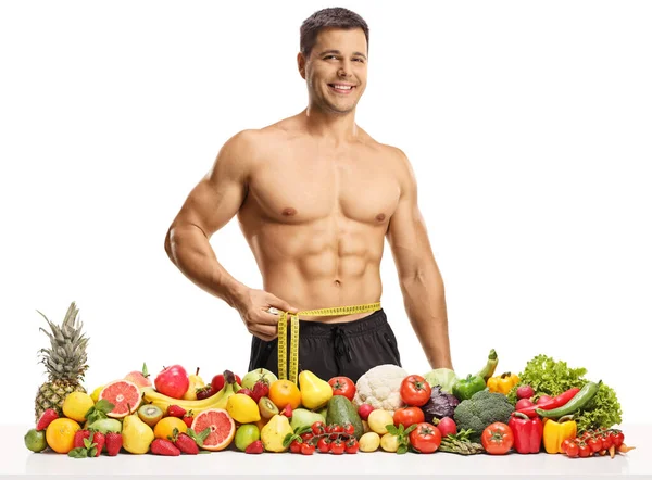 Shirtless Young Muscular Man Measuring His Waist Tanding Pile Fruits — Stock Photo, Image