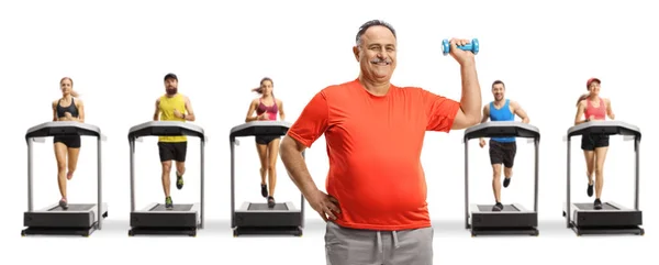 Mature Man Sportswear Lifting Small Dumbbell Front Young People Treadmills — Stock Photo, Image