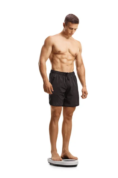 一个体格匀称的肌肉男站在白色背景下的全长镜头 — 图库照片