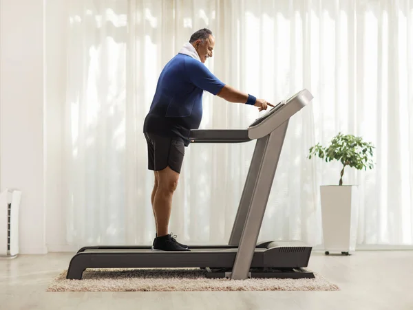 Full Length Profile Shot Mature Man Pushing Power Switch Treadmill — Stock Photo, Image
