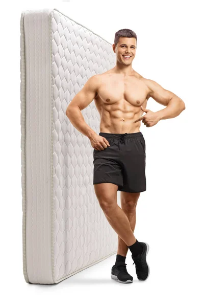 Full Length Portrait Young Shirtless Man Leaning Mattress Pointing Isolated — Stock Photo, Image