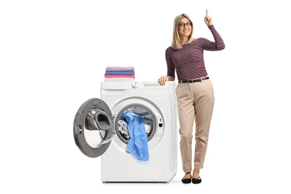 Full Length Portrait Young Woman Leaning Washing Machine Clothes Pointing — Stock Photo, Image