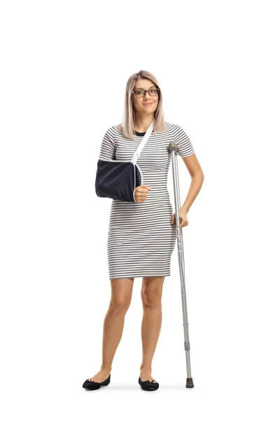 Full Length Portrait Young Woman Arm Sling Crutch Isolated White — Stock Photo, Image